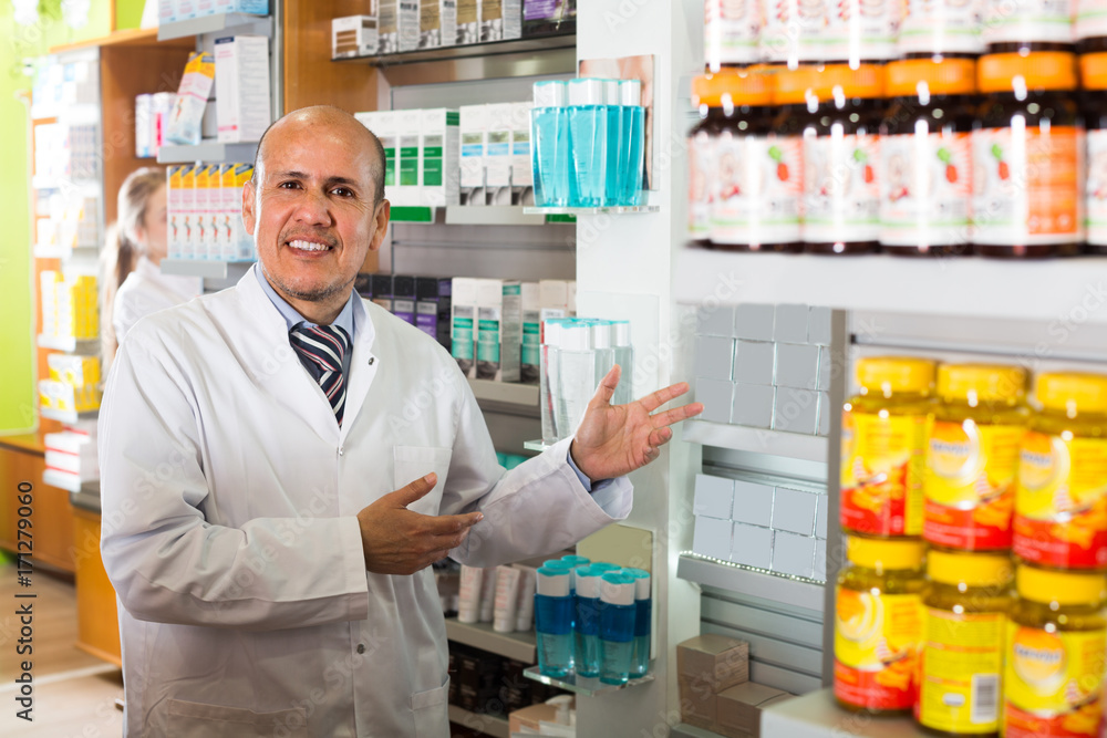 Male working in chemist shop