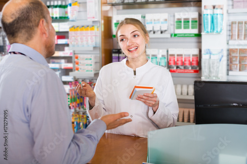 pharmacist counseling customer photo