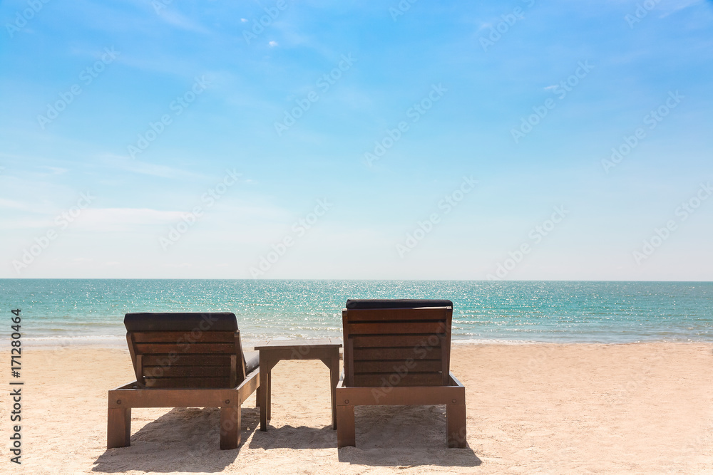 Couple beach chair or sun deck with beautiful sea view on beach under sunshine in day time, Concept of vacation beach and sea in summer holiday