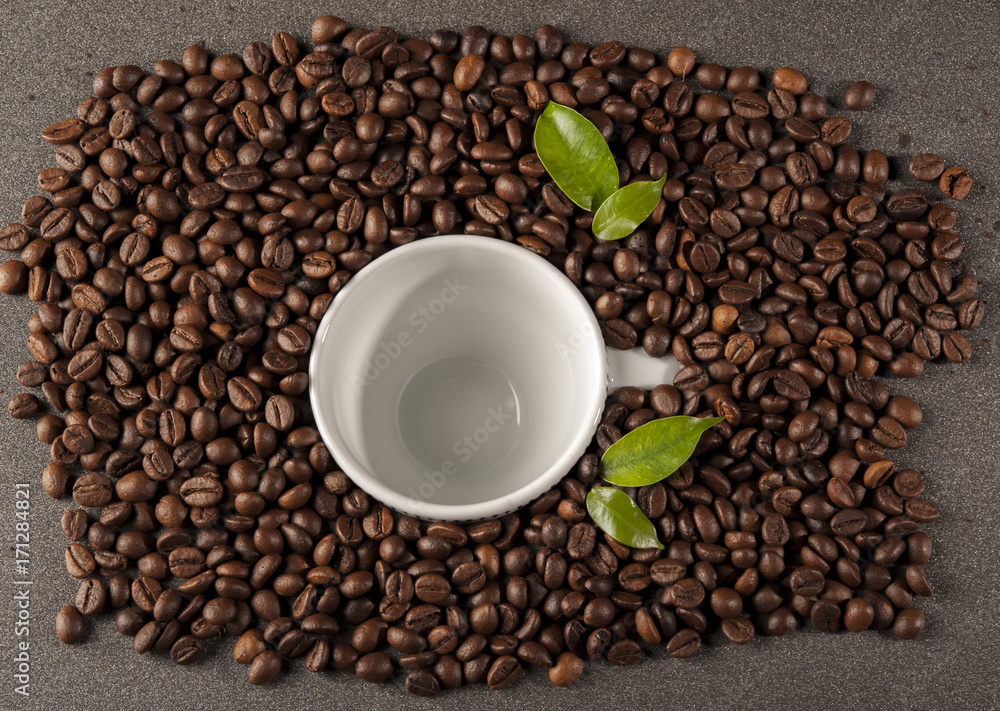 Coffee beans allover white cup of coffee beans