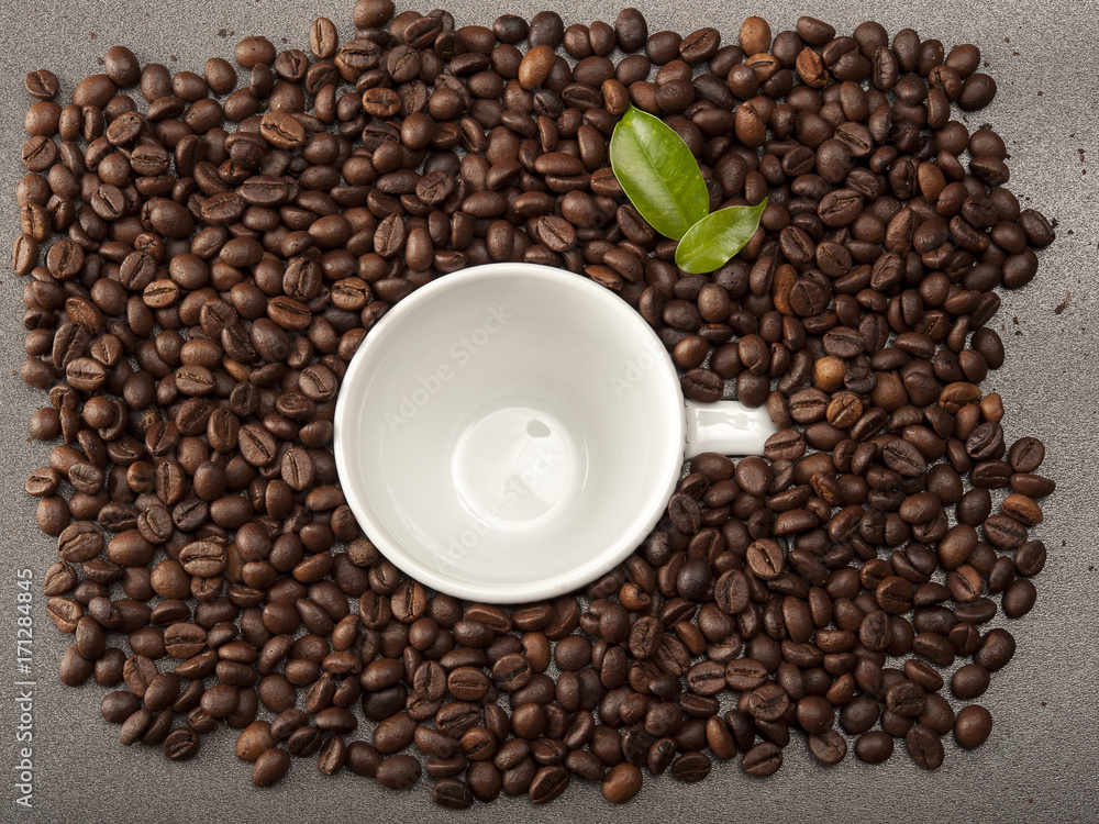 Coffee beans allover white cup of coffee beans Coffee beans allover white cup of coffee beans