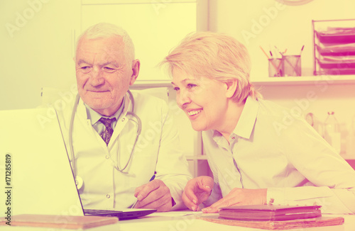 Male doctor with female client