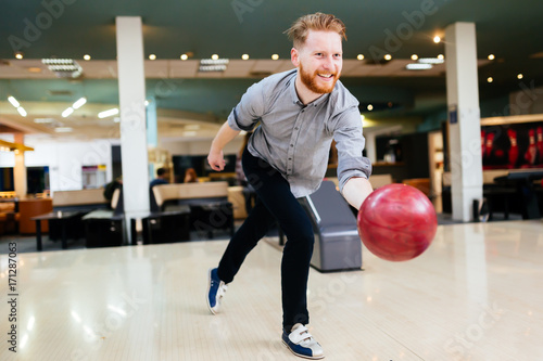 Handsome man bowling