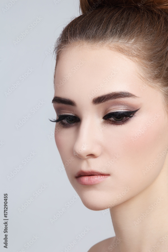 Young beautiful girl with cat eye make-up, copy space Young beautiful girl with cat eye make-up, copy space