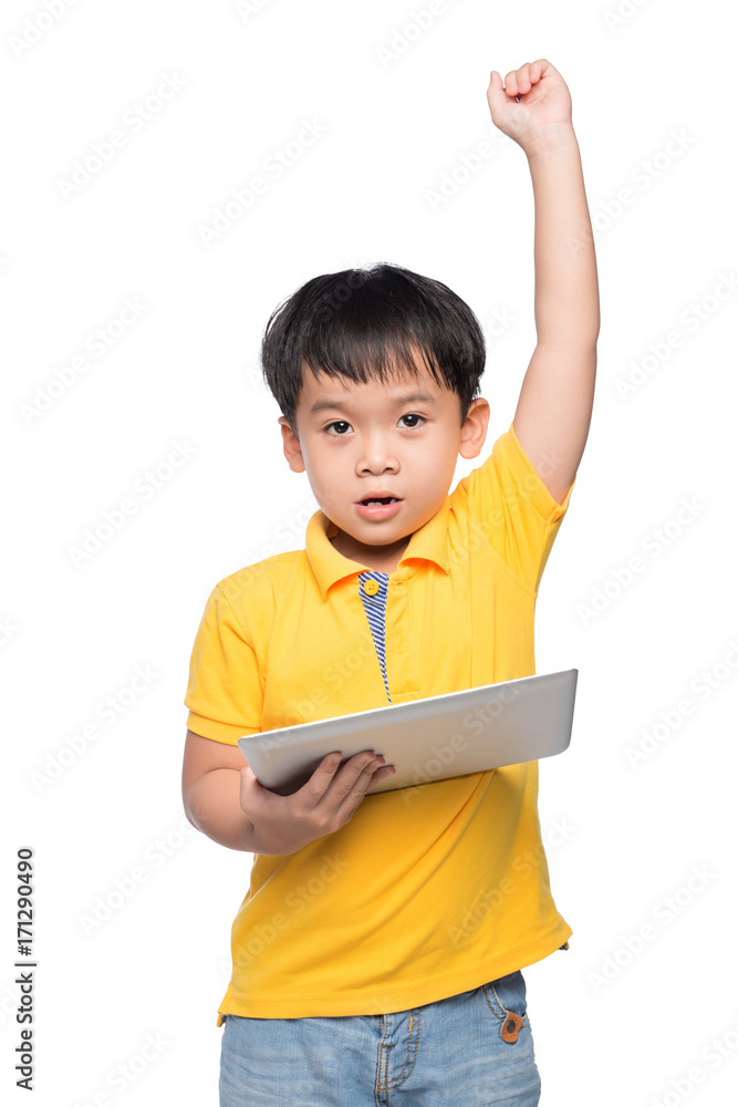 Portrait of cheerful boy with backpack holding digital tablet with hand raised Portrait of cheerful boy with backpack holding digital tablet with hand raised