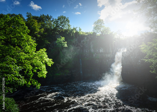 High Force Waterfall views from the south bank of the River Tees on the Pennine Way in woodland, UK. photo