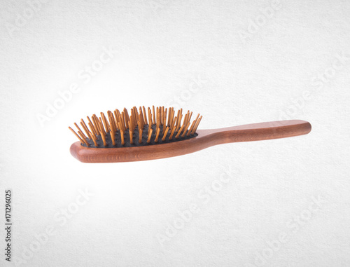 Hairbrush or Wooden Hairbrush on a background.