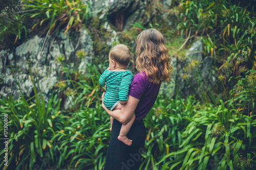 Mother holding baby in nature