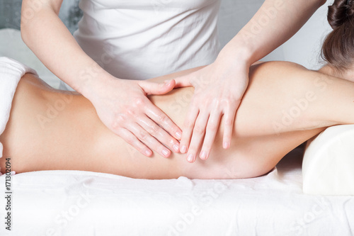 Female massage, back massage woman close up