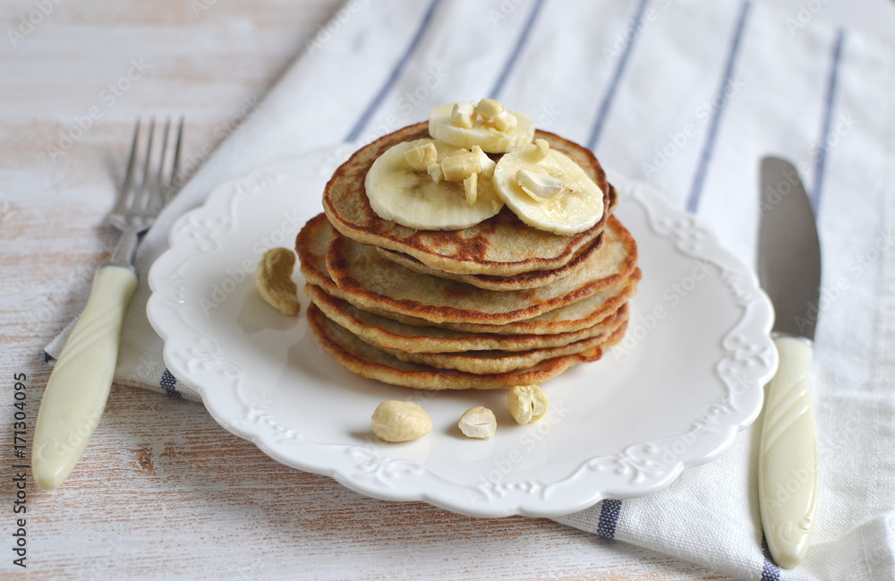 Homemade Banana Cashew Pancakes Honey Sauce Milk Flour Wooden Table Kitchen Towel Cutlery Homemade Banana Cashew Pancakes Honey Sauce Milk Flour Wooden Table Kitchen Towel Cutlery