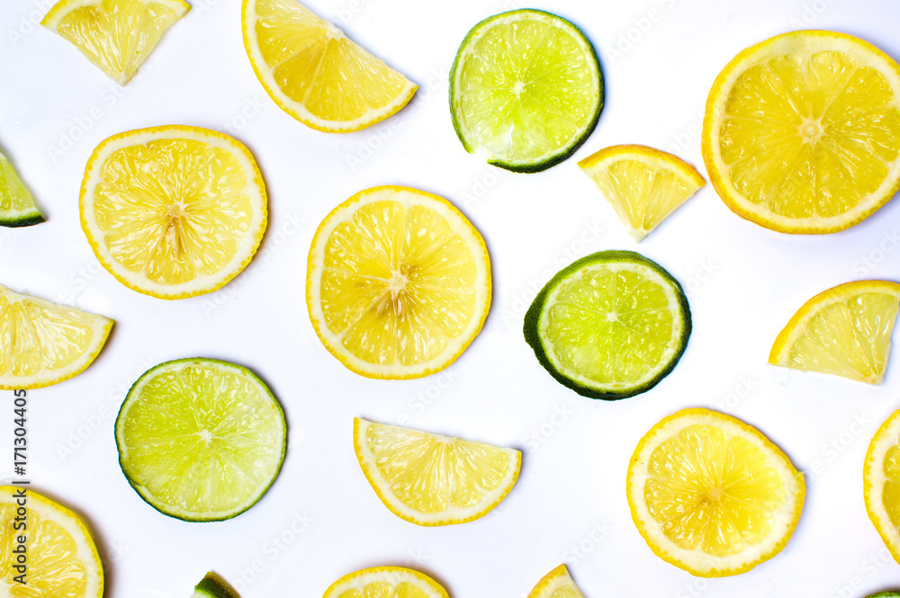 Lemon and lime slices on white