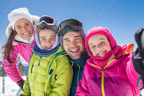 Family taking winter selfie