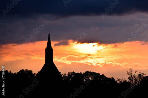 Sunset silhouette of church tower at sunset © Dziurek