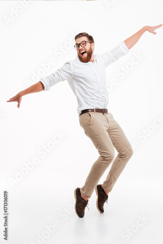 Handsome young bearded man jumping