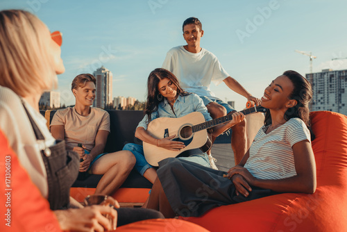 friends having party on roof © LIGHTFIELD STUDIOS