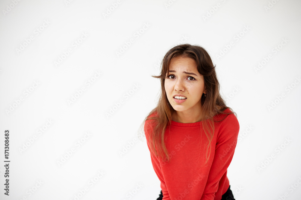 What did you say? Attractive young mixed race female in red top having questionable expression while talking to husband, her look and gestures expressing indignation, distrust or misunderstanding What did you say? Attractive young mixed race female in red top having questionable expression while talking to husband, her look and gestures expressing indignation, distrust or misunderstanding