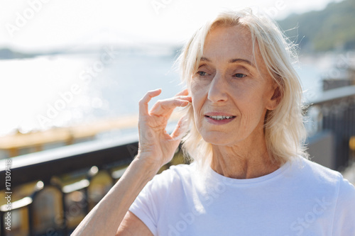Wallpaper Mural Close up of senior woman tidying up her hair Torontodigital.ca