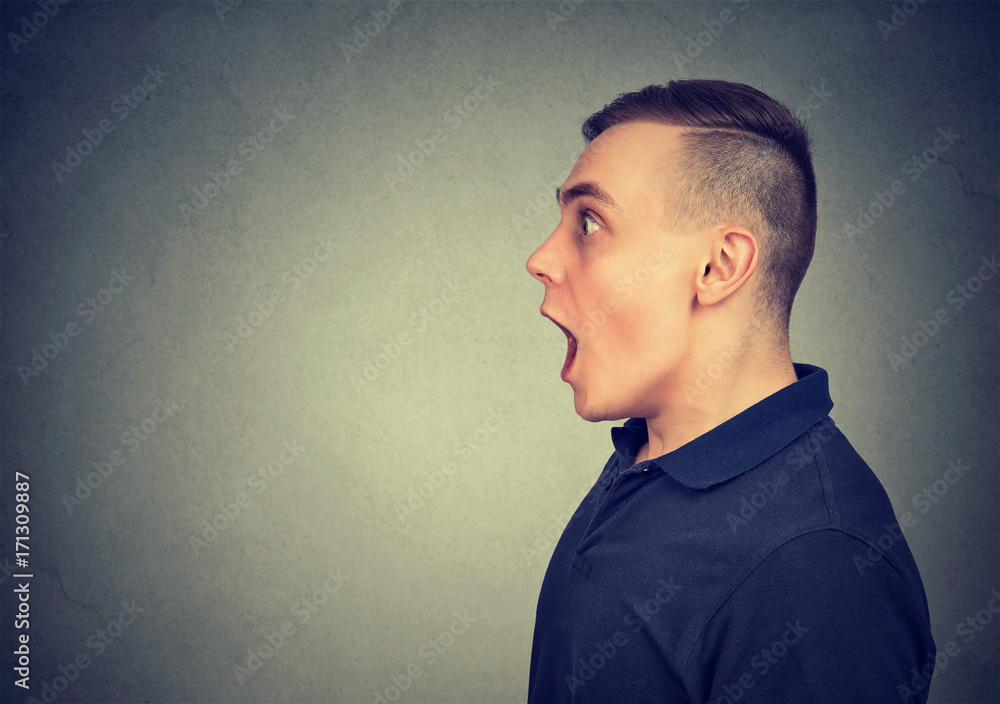 Shocked dazed man isolated on gray background Shocked dazed man isolated on gray background