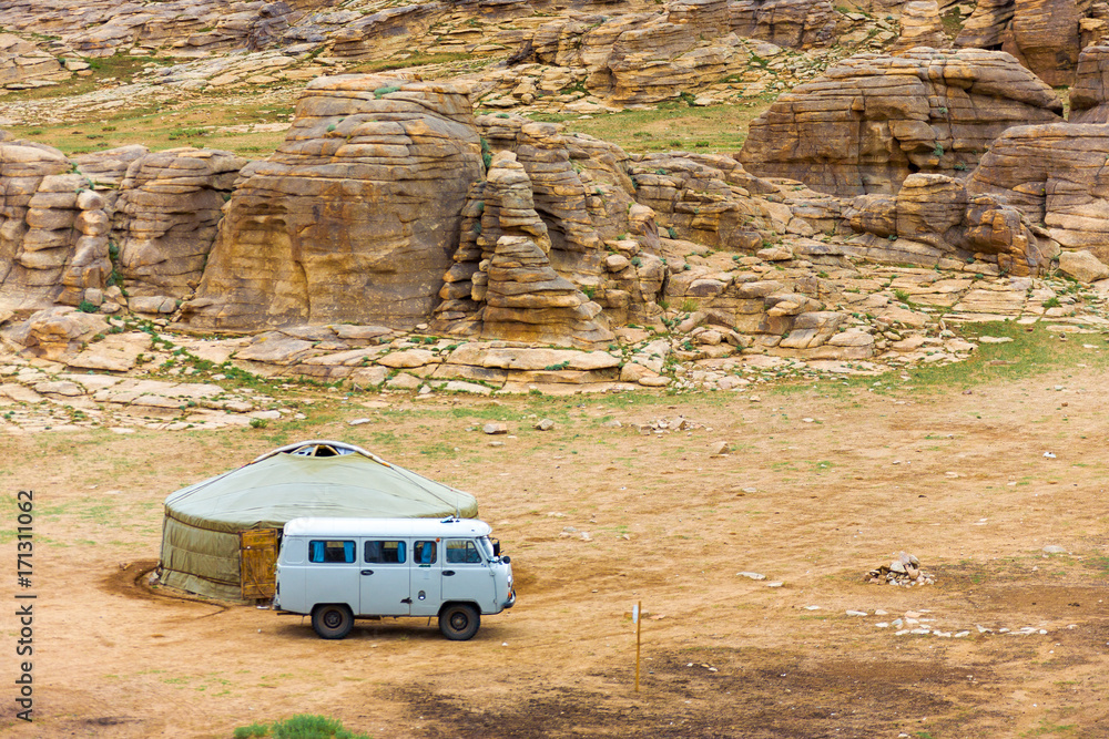 Tourist Van Outside Yurt Rocky Mongolian Landscape