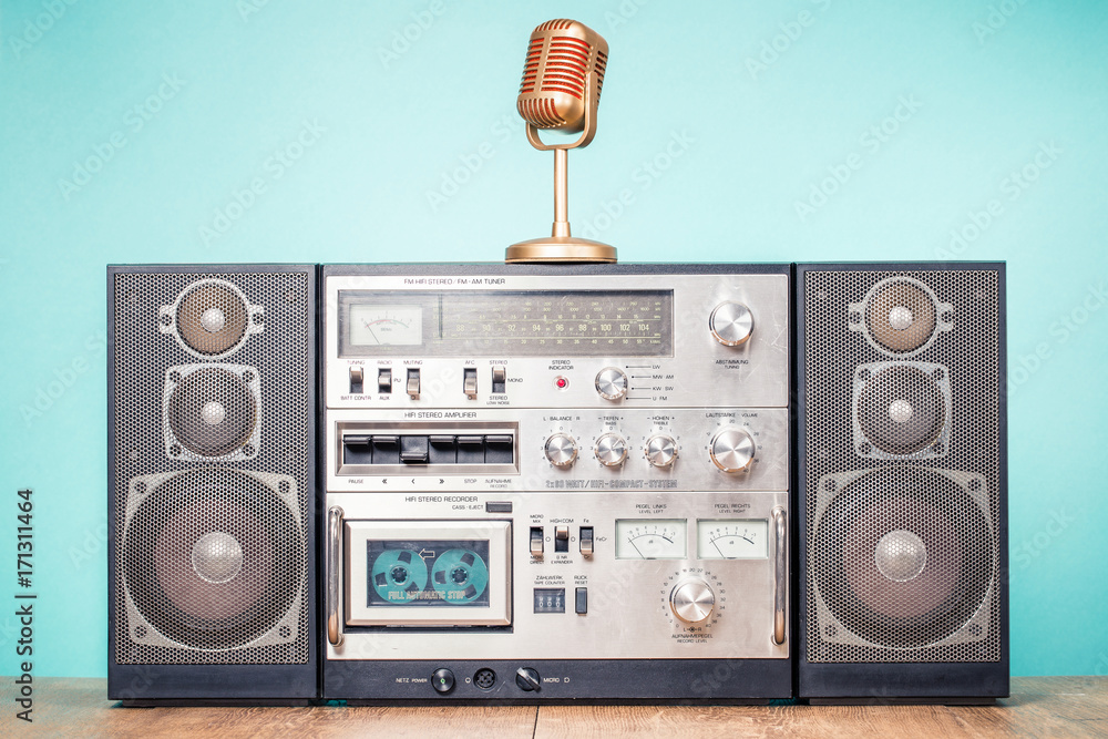 Retro outdated HI FI stereo radio cassette recorder boombox system from 80s  and golden microphone on table front aquamarine background. Vintage  instagram old style filtered photo Stock Photo | Adobe Stock