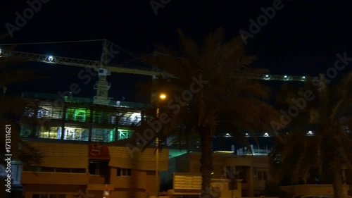 night time illuminated dubai jumeirah hotel construction street view 4k uae
 photo