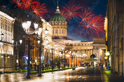 Kazan Cathedral and Nevsky Prospect at night lights old houses fireworks on the background in St. Petersburg