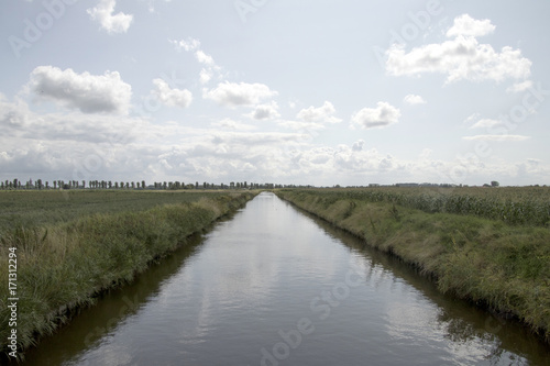 Ditch between cropfields photo