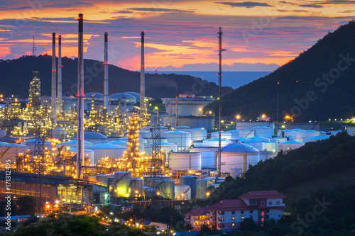 Industrial view Oil refinery and oil tanks plant during at twilight.