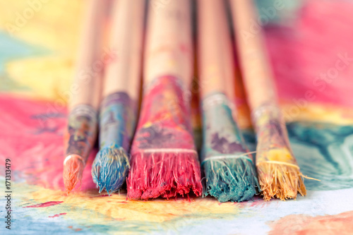 Close-up view of dirty paint brushes