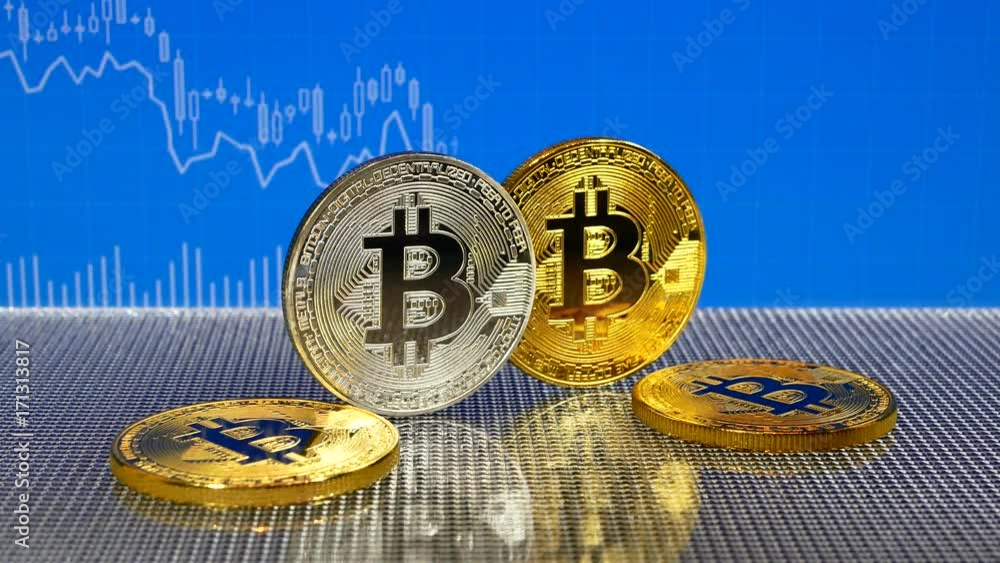Golden and silver bitcoin on blue abstract finance background. Bitcoin cryptocurrency.
