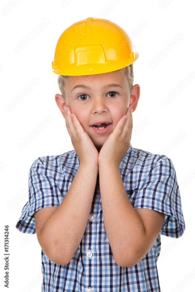 Half-length emotional portrait of a builder boy wearing blue t-shirt and yellow hardhat. Isolated on white background. Half-length emotional portrait of a builder boy wearing blue t-shirt and yellow hardhat. Isolated on white background.