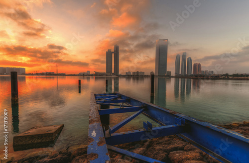 Abu dhabi skyline at the sunrise 