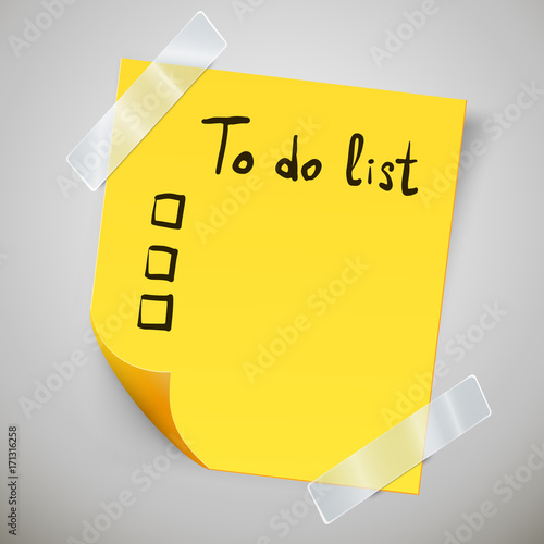 Yellow sticky note with the curled corner and adhesive tape. To do list or memo post.