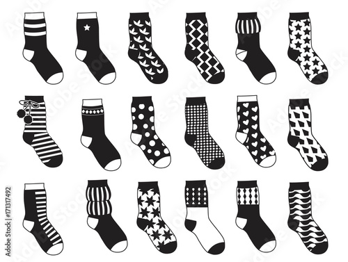 Silhouette of kids socks with different patterns. Vector monochrome illustrations isolate