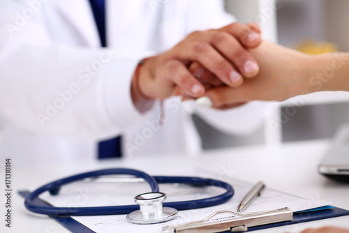 Stethoscope head lying on medical forms closeup