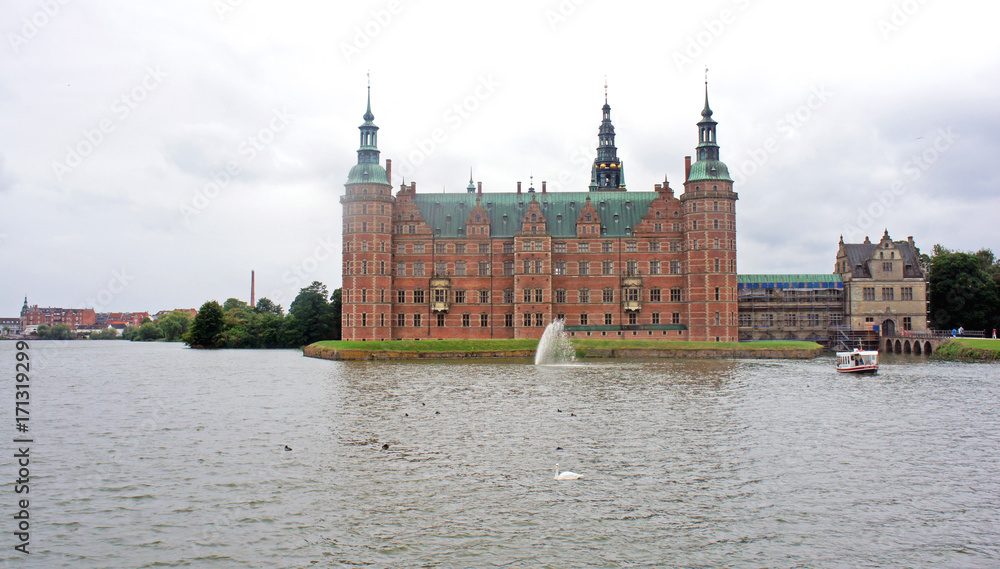 View of Frederiksborg castle (slot) from the garden, cloudy weather, Hillerod, Denmark