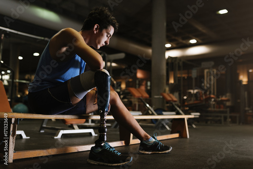 Portrait of disabled young in the gym. photo