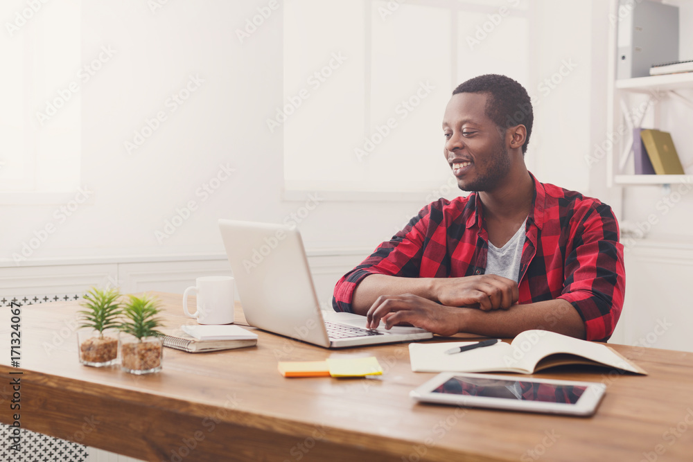 Happy black businessman in casual office, work with laptop Happy black businessman in casual office, work with laptop