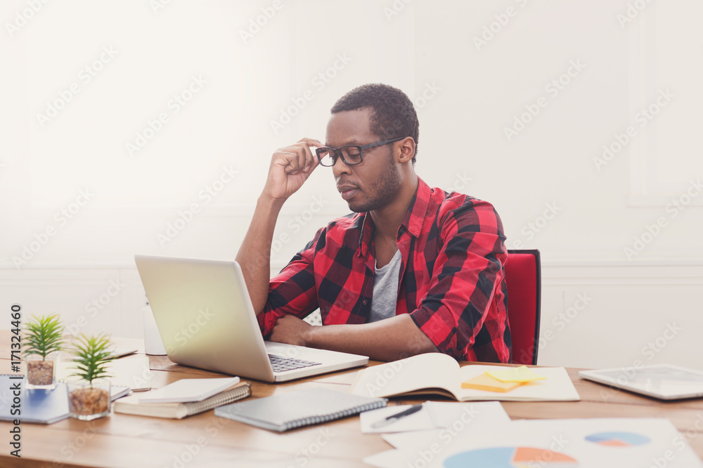 Black businessman in casual office, work with laptop Black businessman in casual office, work with laptop