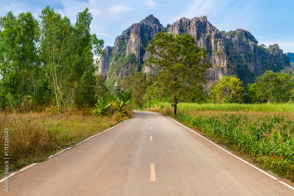Beautiful landscape with road, mountains and blue sky. Travel concept Beautiful landscape with road, mountains and blue sky. Travel concept