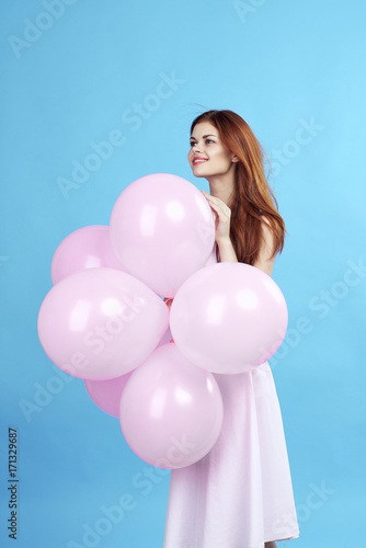 adorable woman holds balloons