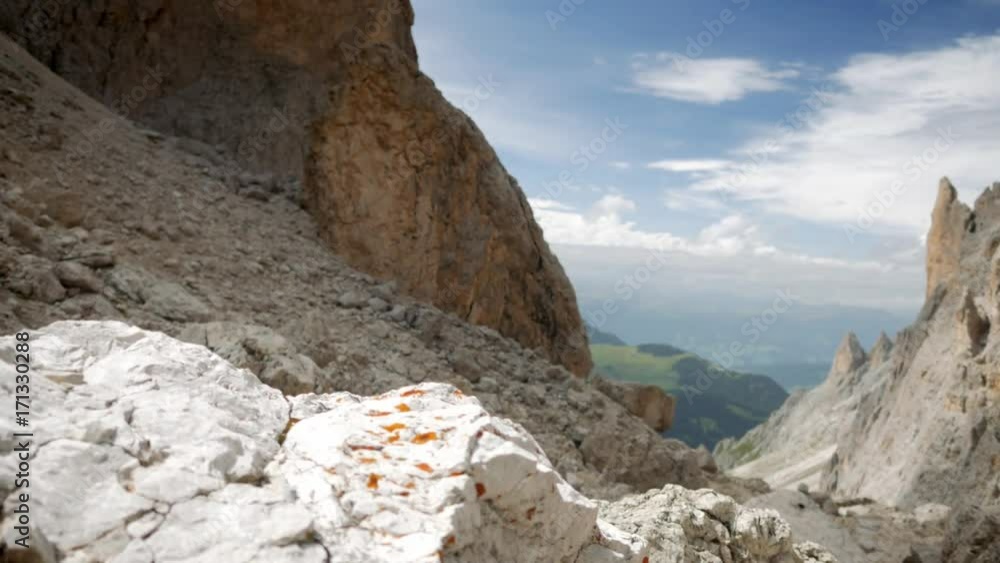 Clouse-up of hiker's legs climbing a pass in mountains Clouse-up of hiker's legs climbing a pass in mountains