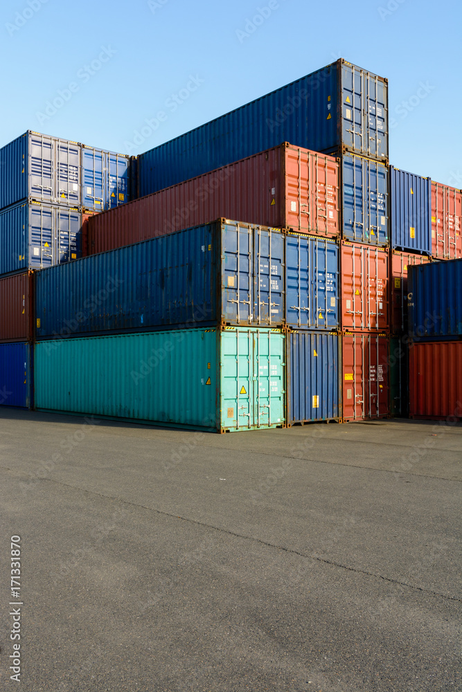Dozens of dry cargo containers stacked in a shipping yard on the river Marne for the supply of supermarkets in Paris. Dozens of dry cargo containers stacked in a shipping yard on the river Marne for the supply of supermarkets in Paris.