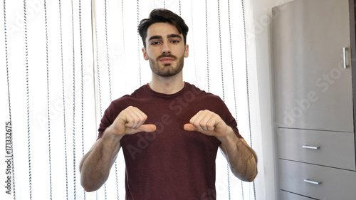 Принти на полотні Handsome young man pointing finger at himself, smiling and looking at camera