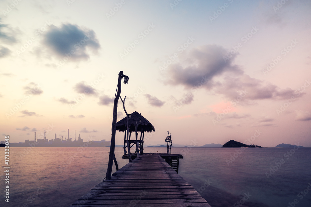 surreal seascape with wood dock in the twilight time