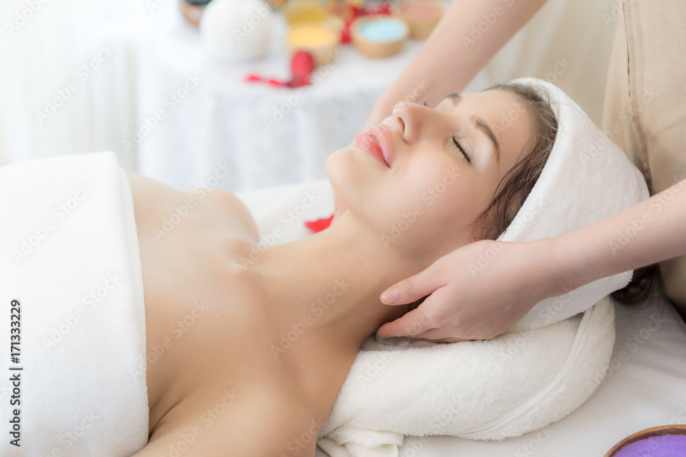 beautiful and healthy young woman relaxing with massage at beauty spa salon beautiful and healthy young woman relaxing with massage at beauty spa salon
