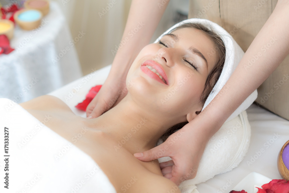 beautiful and healthy young woman relaxing with massage  at beauty spa salon