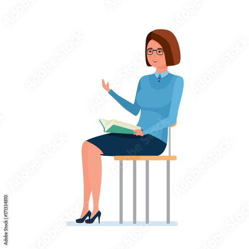 Teacher sitting on chair, holding book and explains school material.