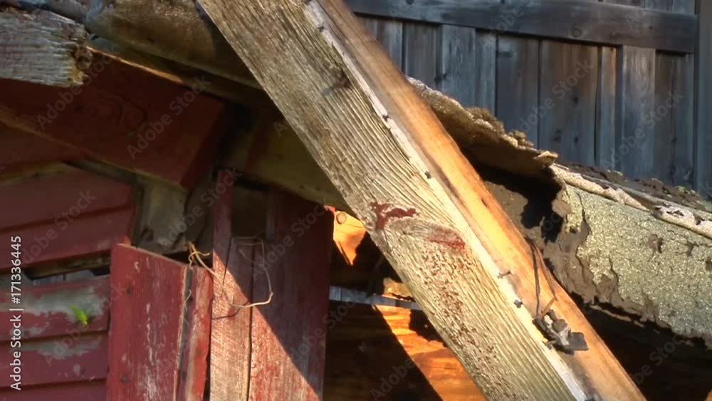 Steady shot of beam in collapsing barn at sunset. Steady shot of beam in collapsing barn at sunset.