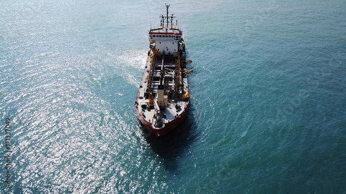 Suction Dredger ship working near the port - with mud, Pollution, brown Muddy water - aerial shot